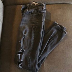 Skinny black ripped jeans.